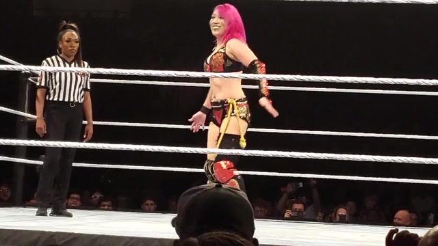 Becky taking a deep stinkface from Asuka!