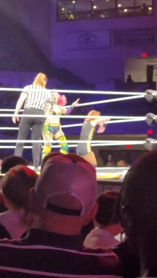 Asuka delivering a really long and intense stinkface to Becky Lynch!
